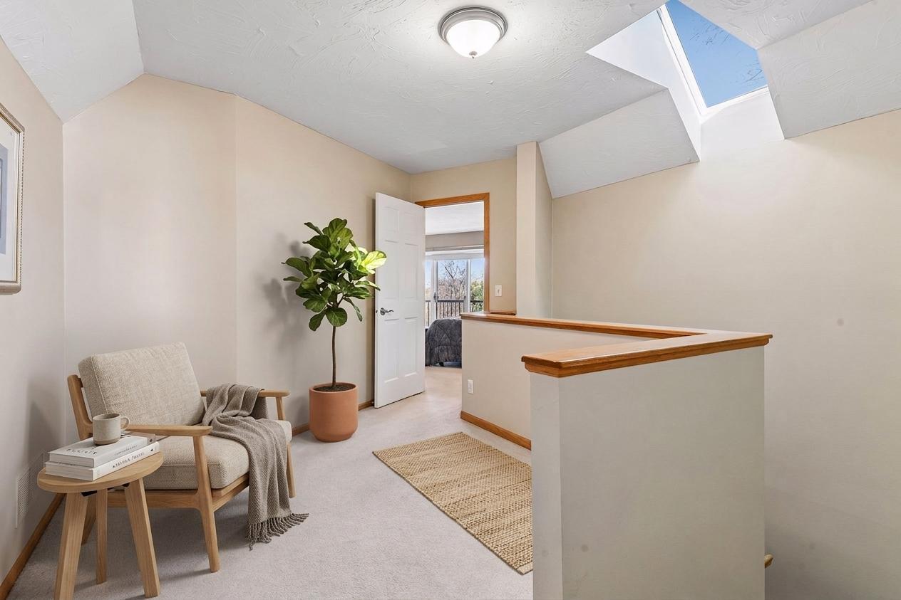 The versatile upper-level loft off the primary suite is a peaceful retreat. Featuring a bright skylight and cozy alcove, it’s the perfect spot for a reading nook, yoga space, or private reading space! *Virtually staged to show design options.