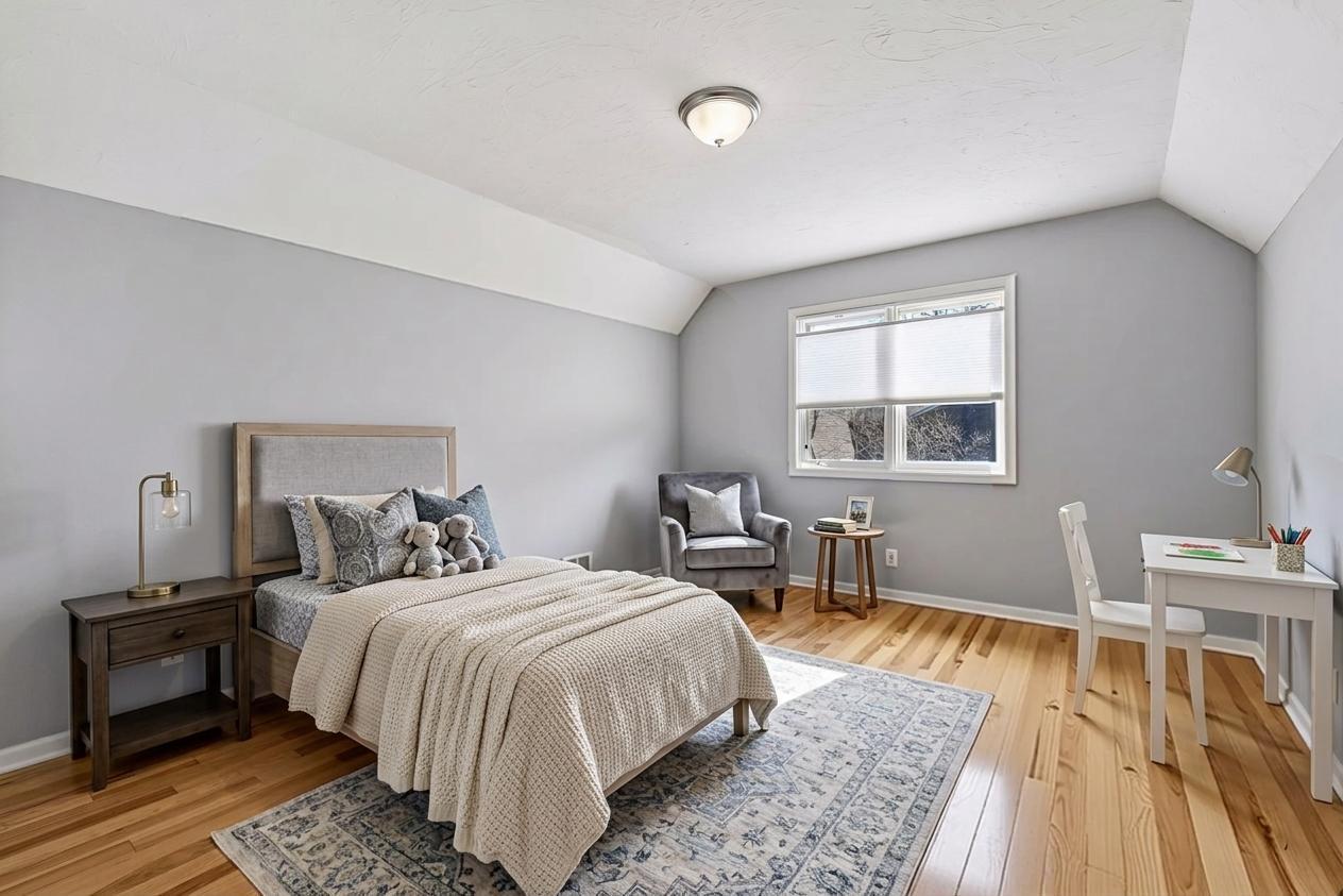 Private bedroom #4 on the upper level with it's own staircase, the spacious room features beautiful hardwood floors and a large walk-in closet. *Virtually staged to show design options.