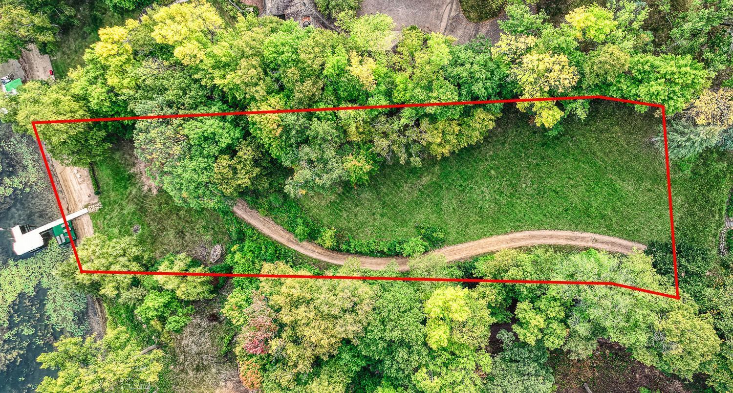 1.25 acre lot lined with mature trees.