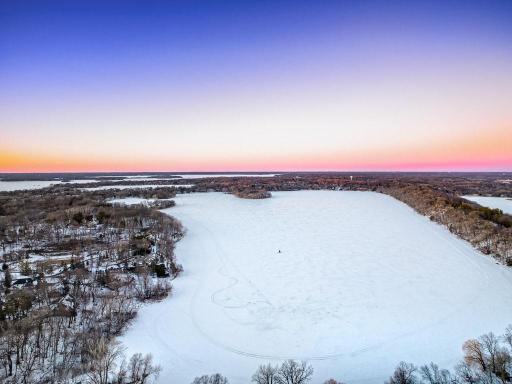 Expansive, snow-covered Christmas Lake transformed into a serene winter playground.