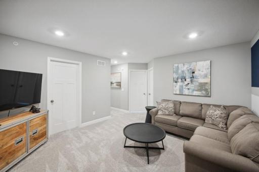 Spacious upper level loft offers a secondary family room area.