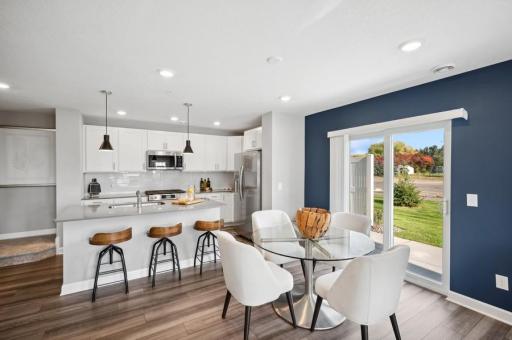 Sliding glass door with concrete patio just outside the dining area!