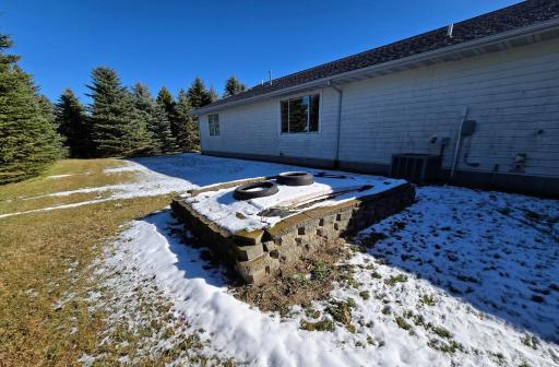 Septic tank under the backyard planter.