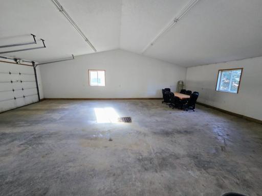 Cement floor with drain & vaulted ceiling. Seller will leave the table & chair set.