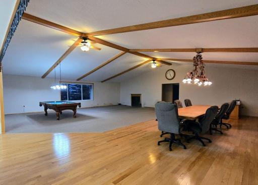 Kitchen, dining & living room are open with vaulated ceiling.