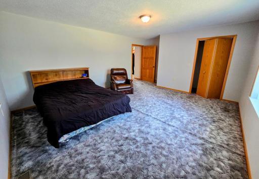14.6 x 19.4 carpeted bedroom with closet