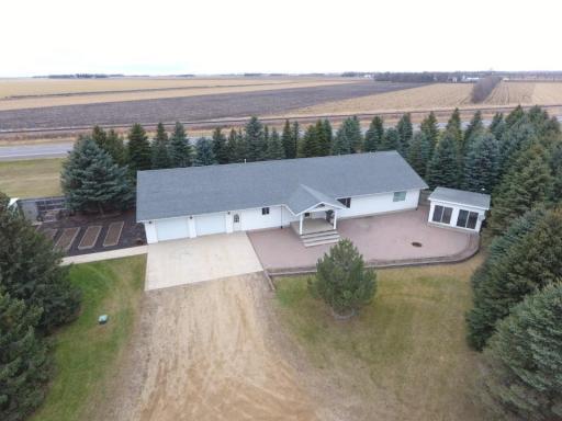 House built in 2003. Mature pine trees provide great windbreak & privacy from highway & wind