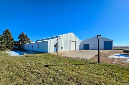 Large gravel parking lot and concrete pad located around the doors.