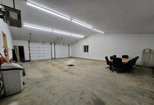 Garage is finished, insulated, heated, floor drain, with central vac, hot/cold water & floor drain. 1200 sq ft.