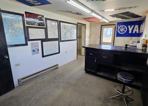 Office area includes infloor heat, electric baseboard heat, & forced air.