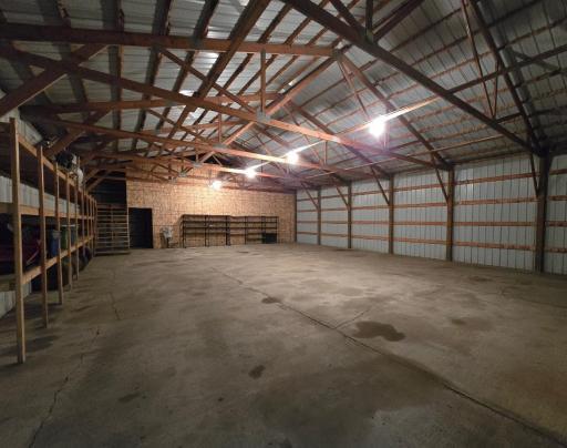 90 x 40 cold storage shed. This section has cement floor, electricity, shelving, upper level & main floor shelving. This part has been sectioned off to 63 x40.
