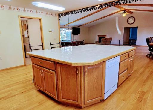 Love this convenient center island with convenient seating, storage, & dishwasher.