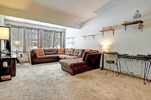 Living Room with a lot of Natural Light and Vaulted Ceilings. This is the Open Floor Plan.