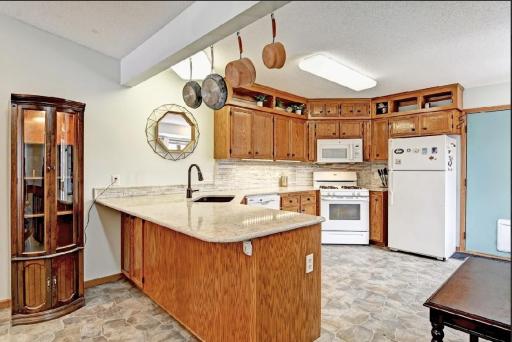 Another view of the Kitchen and a great place to add barstools to enjoy a little get together or maybe your morning coffee