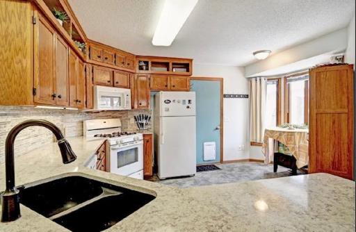 Another view of the Kitchen and this leads out to the Oversized Garage