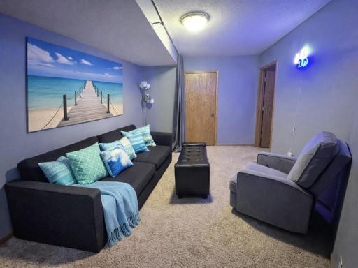 Family Room -The decorated pillows, throw and picture are created by an AI.