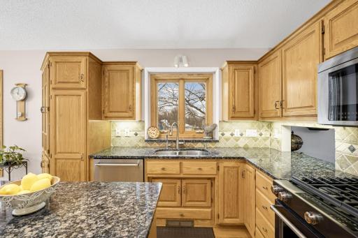 Desirable kitchen window over-looking the pond. Cabinet pantry space in the kitchen.
