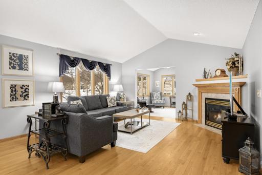 Huge great room with gas burning fireplace, large windows letting in all the sunlight.