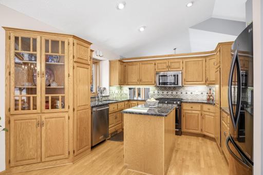 Fabulous kitchen with an abundance of cabinets with raised panel oak doors.