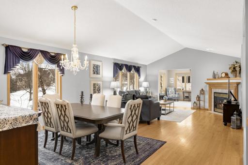 Hardwood floors through entire main level with soaring vaulted ceilings.