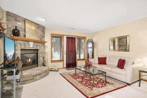 Second gas burning fireplace with brick surround.