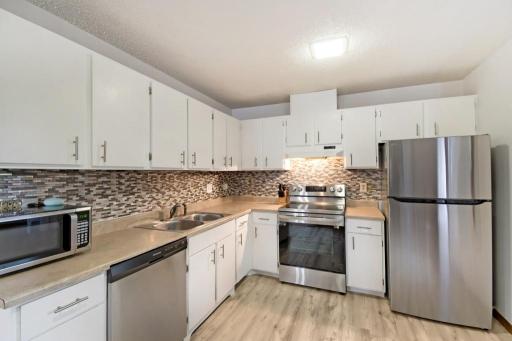 The kitchen is in nice condition with plenty of cabinets and stainless steel appliances!