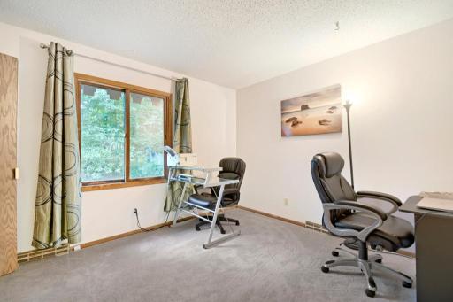 This main-level bedroom is the third bedroom in the home and currently serves as an office. It could easily serve as a bedroom however.