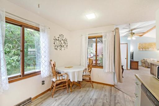 The eat-in kitchen area is a perfect place for a quick meal with pleasant views o the backyard and deck.