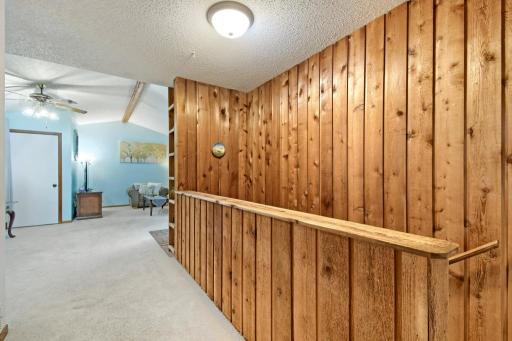 Head back toward the stairs and you will find one of the three bedrooms.