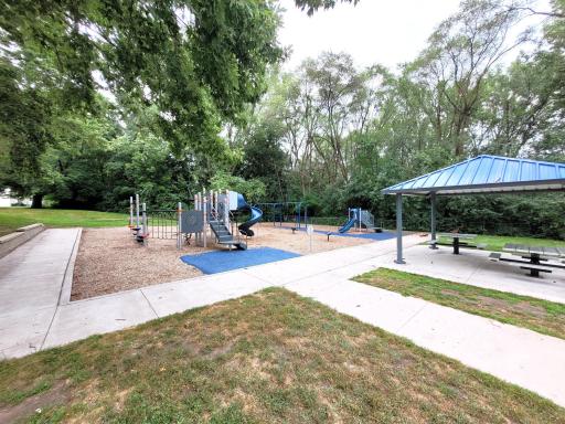 The park nearby offers a play area and a picnic area to enjoy.