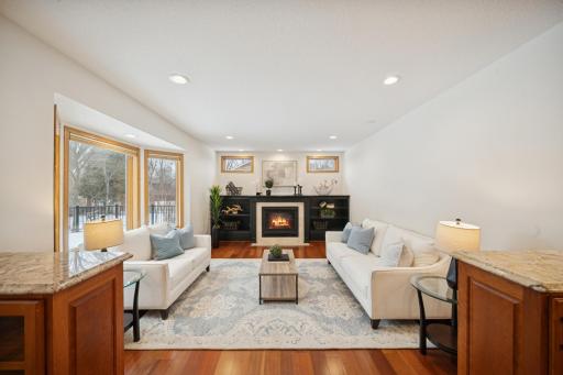 Warm up in front of the fireplace flanked by solid wood built-ins!
