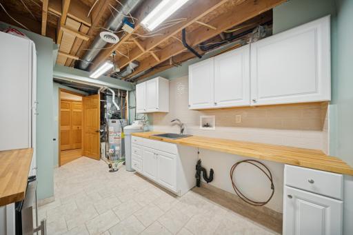 Workroom to house maintenance supplies for the home and lose yourself in hobbies! Water heater was replaced 2023.