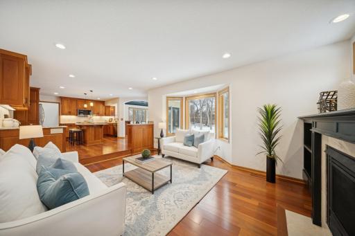 Beautiful great room with picture windows that look out onto the patio, yard, and play area.