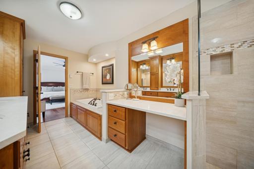 Vanity and jacuzzi bathtub.