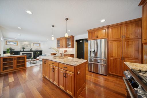 Garage and foyer entraces connect to the kitchen. The kitchen has stone counters and LG smart stainless steel appliances, and a brand new backsplash!