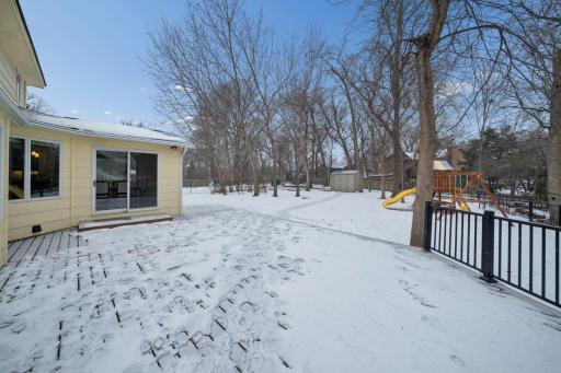 Large patio with access to the dining room leads down to the spacious yard and shed to store gardening and lawn care items.