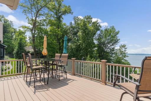 The deck is maintenance free and has stairs leading to the lake