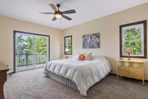 Primary bedroom suite with a private deck