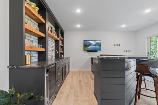 Bar includes a dishwasher, 2 beverage refrigerators and a microwave