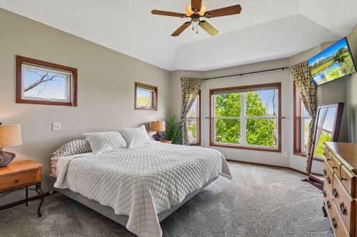 Main floor primary suite with backyard views