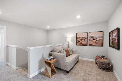 Convenient upper level loft space - perfect for a TV, game area, or working from home. Photo is of model home. Colors and options may vary. Ask Sales Agent for details.