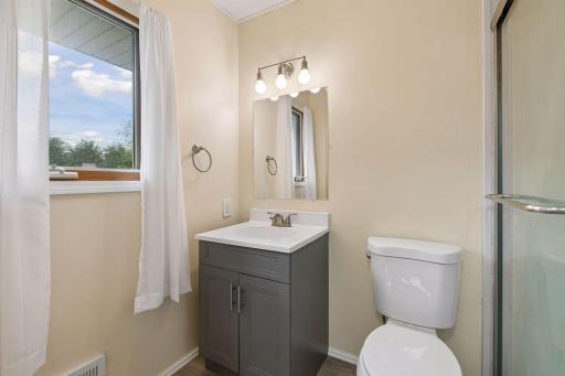 Upper Floor: Ensuite water closet with shower, are separate from the larger vanity.