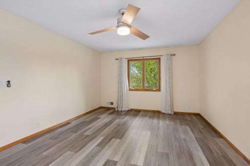 Upper Floor: The Primary Bedroom with a window facing front of the house.