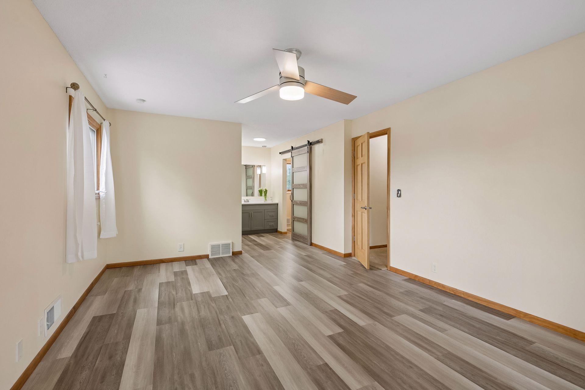 Upper Floor: View of the primary bedroom toward walk-in closet and ensuite bath.