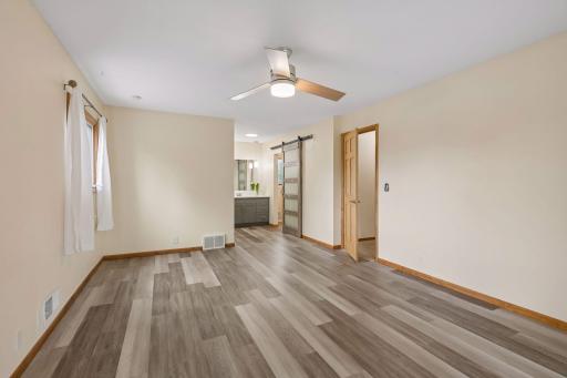 Upper Floor: View of the primary bedroom toward walk-in closet and ensuite bath.