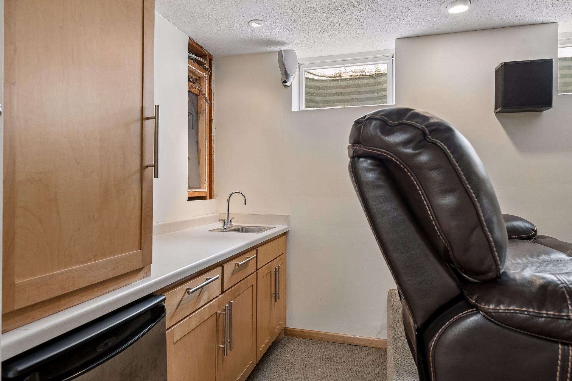 Basement: Home Theater Room Wet-bar and mini-fridge.