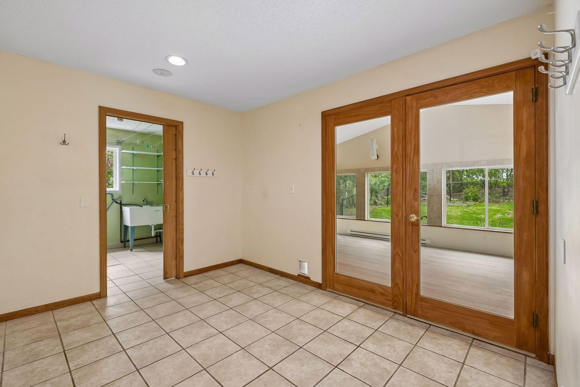 View of laundry room and the sunroom off the entry suite,