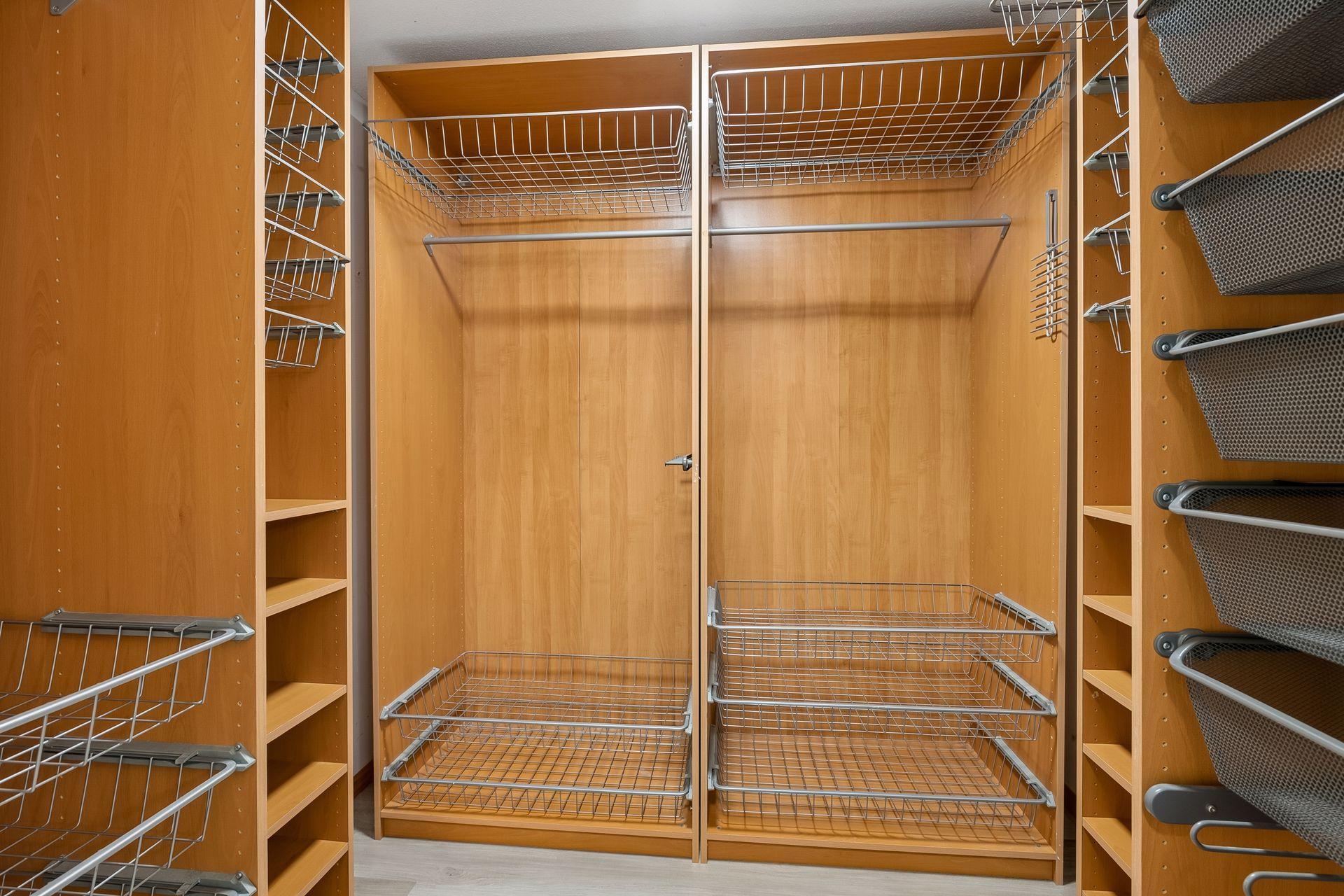Upper Floor: Primary Bedroom walk-in closet organizer.