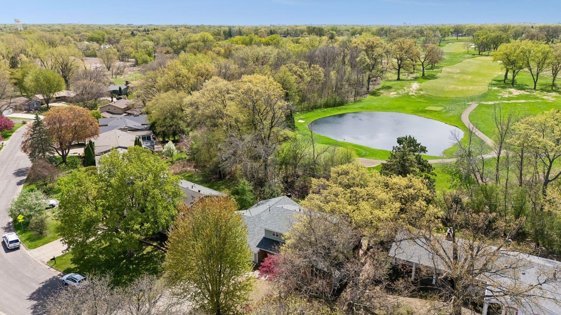 NW Aerial View toward golf course and pond.