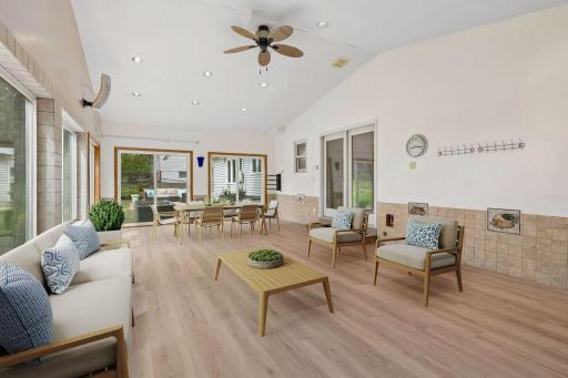 This spacious sunroom offers two walls of windows and a vaulted ceiling! Virtually Staged.